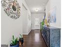 Welcoming entryway with hardwood floors, decorative accents, and ample natural light at 88 Hardy Water Dr, Lawrenceville, GA 30045