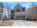 Attractive two-story home featuring a brick facade and a spacious two-car garage at 88 Hardy Water Dr, Lawrenceville, GA 30045
