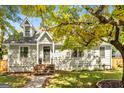 Charming home with shingle siding, brick steps, and mature trees at 1471 Hardin Ave, College Park, GA 30337