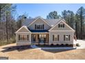Well-maintained exterior showcasing the home's architectural details, including a mix of siding and stone accents at 624 Bexley Rd, Moreland, GA 30259