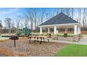 Outdoor amenities including a playground, picnic tables, and a gazebo for the community's enjoyment at 436 Reflection Drive # 15, Stockbridge, GA 30281