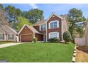 Traditional two-story home with well-maintained lawn and mature trees in a suburban setting at 848 Gateshead Ct, Lawrenceville, GA 30043
