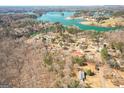 Breathtaking aerial view of the neighborhood and Lake, showcasing the serene lakeside living at 6365 Mountain View Trl, Cumming, GA 30041