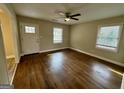 Bright living room with hardwood floors and natural light at 9184 Thrash Sw St, Covington, GA 30014