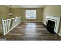 Bright living room with hardwood floors, fireplace, and large windows providing natural light at 2232 Ramblewood Ne Cir, Decatur, GA 30035