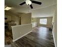 Inviting open-concept living room with hardwood floors, fireplace, and seamless transition to the kitchen at 2232 Ramblewood Ne Cir, Decatur, GA 30035