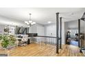 Bright open area with wood floors, a staircase, and a view to other rooms at 3099 Balearic Se Dr, Marietta, GA 30067