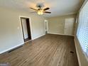 Inviting living room with new flooring, fresh paint, and ample natural light at 1908 S Columbia Pl, Decatur, GA 30032