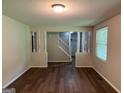 Open living room with hardwood floors and staircase access at 2691 Old South Dr, Jonesboro, GA 30236