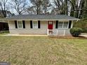 Inviting single-story house with a red front door and freshly painted facade at 1145 Penn Se Ct, Atlanta, GA 30315