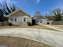 Charming single-story home with brick facade and curved driveway at 5319 Orly Ter, South Fulton, GA 30349