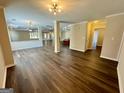 Spacious open-concept living area with hardwood floors and recessed lighting at 5319 Orly Ter, South Fulton, GA 30349