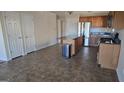 Spacious kitchen area boasting an island, wooden cabinetry, stainless steel refrigerator, and lots of space at 1006 Harbor View Ln, Mcdonough, GA 30252