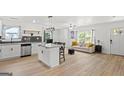Bright and open living space with hardwood floors, an island kitchen, and ample natural light at 1077 Peeples Sw St, Atlanta, GA 30310