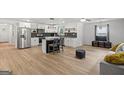 Spacious open floor plan with modern kitchen flowing to living area, great for entertaining at 1077 Peeples Sw St, Atlanta, GA 30310
