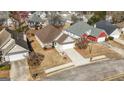 This is an aerial view of a well-kept single Gathering home with a driveway and manicured landscaping at 1160 Strath Clyde Way, Mcdonough, GA 30253