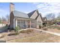 Inviting covered porch with seating area enhances this home's curb appeal at 101 Dean Cir, Mcdonough, GA 30253