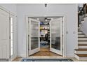 Office entrance with decorative glass doors and custom shelving at 2407 Honey Ct, Mcdonough, GA 30252