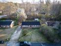 Overhead shot of the brick ranch on a lot with mature trees at 1326 Hatchcover Cir, Jonesboro, GA 30238