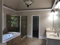 Elegant primary bathroom with double vanity, soaking tub, and a glass shower at 2741 Willowstone Dr, Duluth, GA 30096