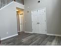 Inviting entryway with gray walls, a high ceiling, and durable wood-look flooring at 11 Carriage Lake Dr, Stockbridge, GA 30281