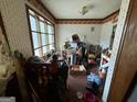 This room has a big window, brick floor and wallpaper at 5970 Avenue Of Redwoods, South Fulton, GA 30349