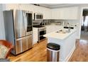 Updated kitchen featuring stainless steel appliances and white cabinets at 3213 Sweetbriar Dr, Villa Rica, GA 30180