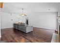 Spacious living room featuring hardwood floors, a ceiling fan, and lots of natural light at 121 Colemans Bluff Dr, Woodstock, GA 30188