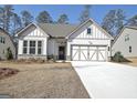 Charming single-Gathering home with a two-car garage and inviting curb appeal in a serene neighborhood at 82 Airmont Dr, Sharpsburg, GA 30277
