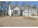 Charming single-Gathering home with a two-car garage and inviting curb appeal in a serene neighborhood at 82 Airmont Dr, Sharpsburg, GA 30277