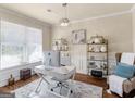 Home office features a light fixture, window with blinds, and modern decor at 2361 Hanover Woods Rd, Lithonia, GA 30058