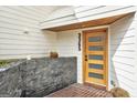 Modern front door with glass panes at 3365, accompanied by a brick planter at 3365 Turtle Lake Se Dr, Marietta, GA 30067