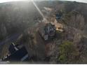 Ariel view of home nestled in the surrounding woods and neighborhood at 5700 Thrasher Sw Ln, Conyers, GA 30094