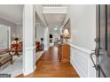 Inviting foyer with hardwood floors and classic decor, leading to various living spaces at 211 Mill Grove Sw Way, Smyrna, GA 30082