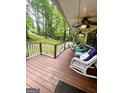 Inviting covered porch with comfortable seating, overlooking a lush green yard at 1972 Cox Dr, Austell, GA 30168
