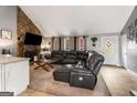 Comfortable living room with stone fireplace, vaulted ceilings, and inviting neutral decor at 3747 Junior Ln, Douglasville, GA 30135