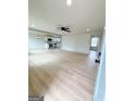 Spacious open-concept living room flows into the modern kitchen, creating an inviting and connected living space at 299 Lagrange St, Grantville, GA 30220