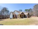 Beautiful two-story home with a blue exterior, cedar accents, and a well-manicured front lawn at 430 Gregory Rd, Covington, GA 30014