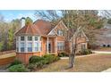 Charming brick home with a well-manicured lawn and a lovely bay window at 510 Virginia Highlands, Fayetteville, GA 30215