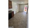 Bright kitchen dining area leading to backyard access at 220 Cabriolet Trl, Mcdonough, GA 30253