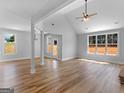 Bright and airy living room featuring hardwood floors, high ceilings, and large windows at 4139 Alayna Lee Cir, Mcdonough, GA 30252