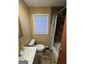 Cozy bathroom featuring a tub/shower combo, toilet and window at 452 Fedora Nw Way, Atlanta, GA 30331