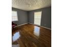 Bright bedroom with wood floors, fresh paint and sun-lit windows at 452 Fedora Nw Way, Atlanta, GA 30331