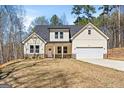 Charming home showcasing a well-manicured lawn, neutral siding, an attached garage, and a welcoming front porch at 485 N Oakland Circle, Mcdonough, GA 30253