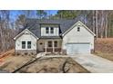 Beautiful home showcasing neutral siding, stone accents, an attached garage, and a covered front porch at 485 N Oakland Circle, Mcdonough, GA 30253