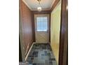 Charming entryway with stone tile and a decorative hanging light fixture at 2518 Caladium Ne Dr, Atlanta, GA 30345
