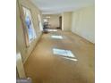 Bright living room featuring large windows, carpeted floors, and ample natural light at 2518 Caladium Ne Dr, Atlanta, GA 30345