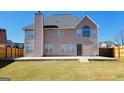 Spacious backyard with a new concrete patio and full fencing perfect for entertainment and privacy at 7926 Palomino Pass, Riverdale, GA 30274