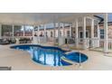 Covered pool with adjacent outdoor seating and entertainment area at 1500 Highway 155 North, Mcdonough, GA 30252
