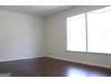 Serene bedroom with hardwood floors and a bright window creating a cozy atmosphere at 3647 Glen Mora Dr, Decatur, GA 30032